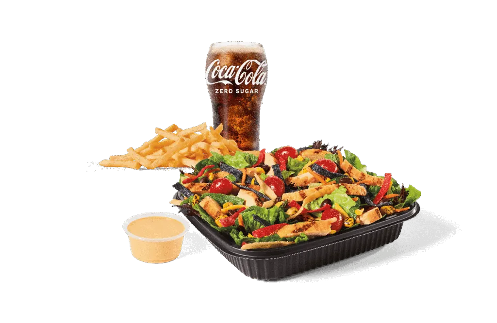 Grilled chicken Southwest salad paired with a drink for a lighter combo.